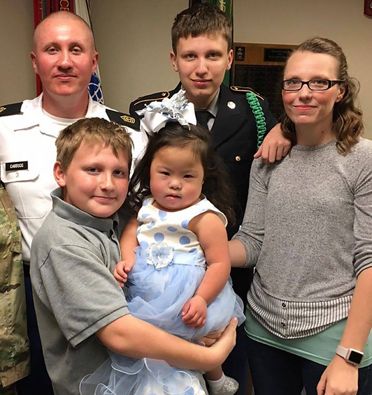 Melanie Carrigg with her brothers and parents.